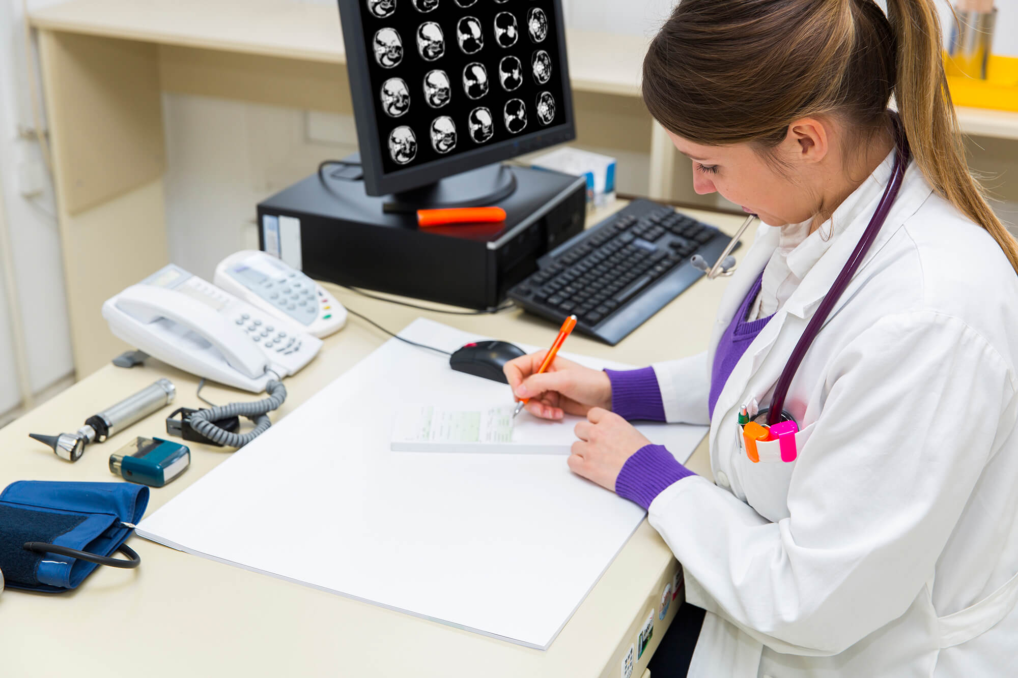 Reviewing a patient's abdominal scans.