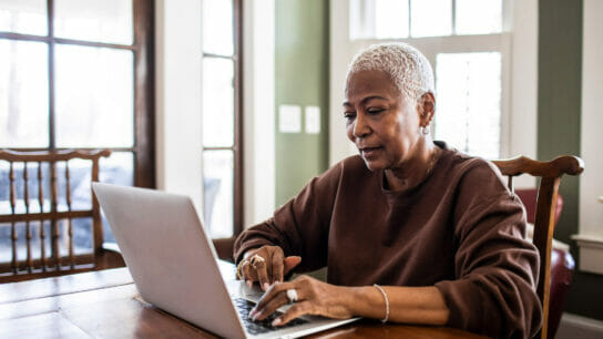Older black woman on computer.