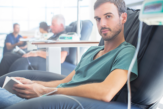 A young man undergoes chemotherapy.