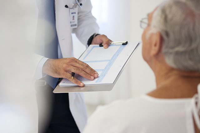 Conferring with a patient about treatment.