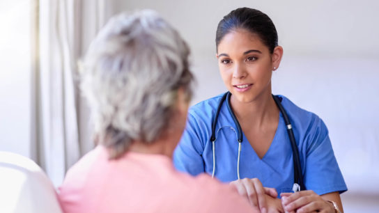 Nurse comforts a patient.