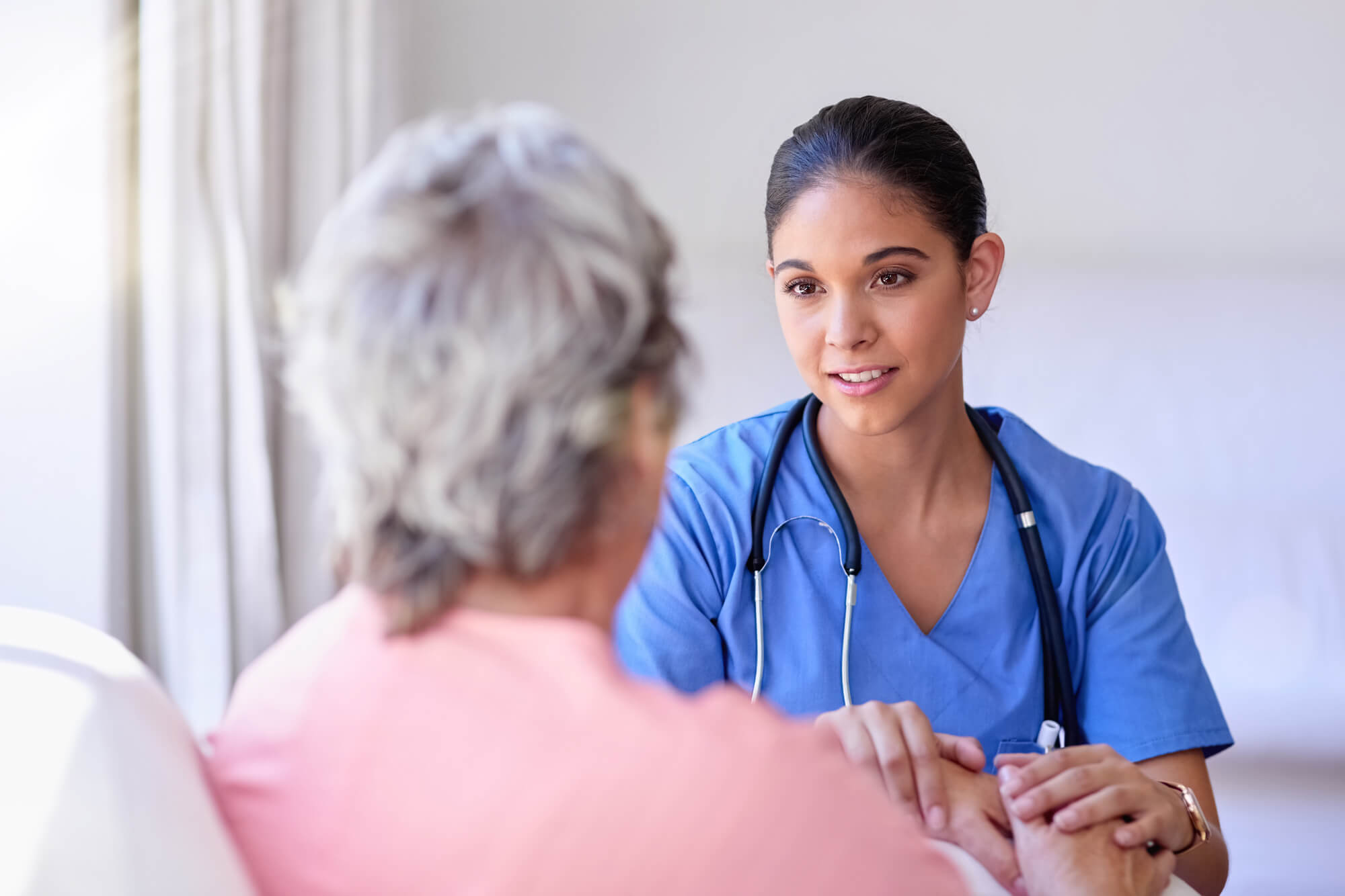 Nurse comforts a patient.