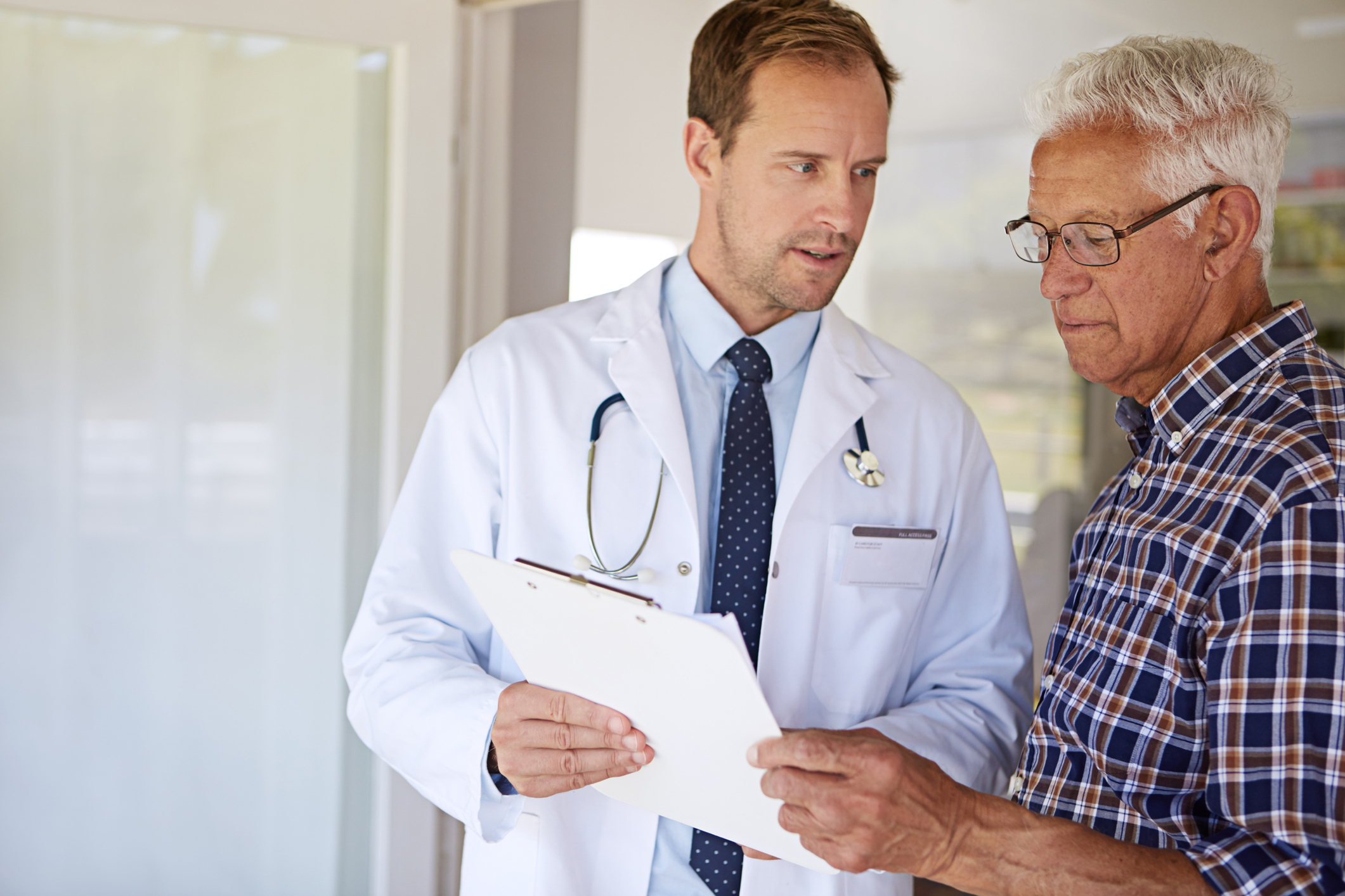 Cropped shot of a male doctor talking to a senior patient