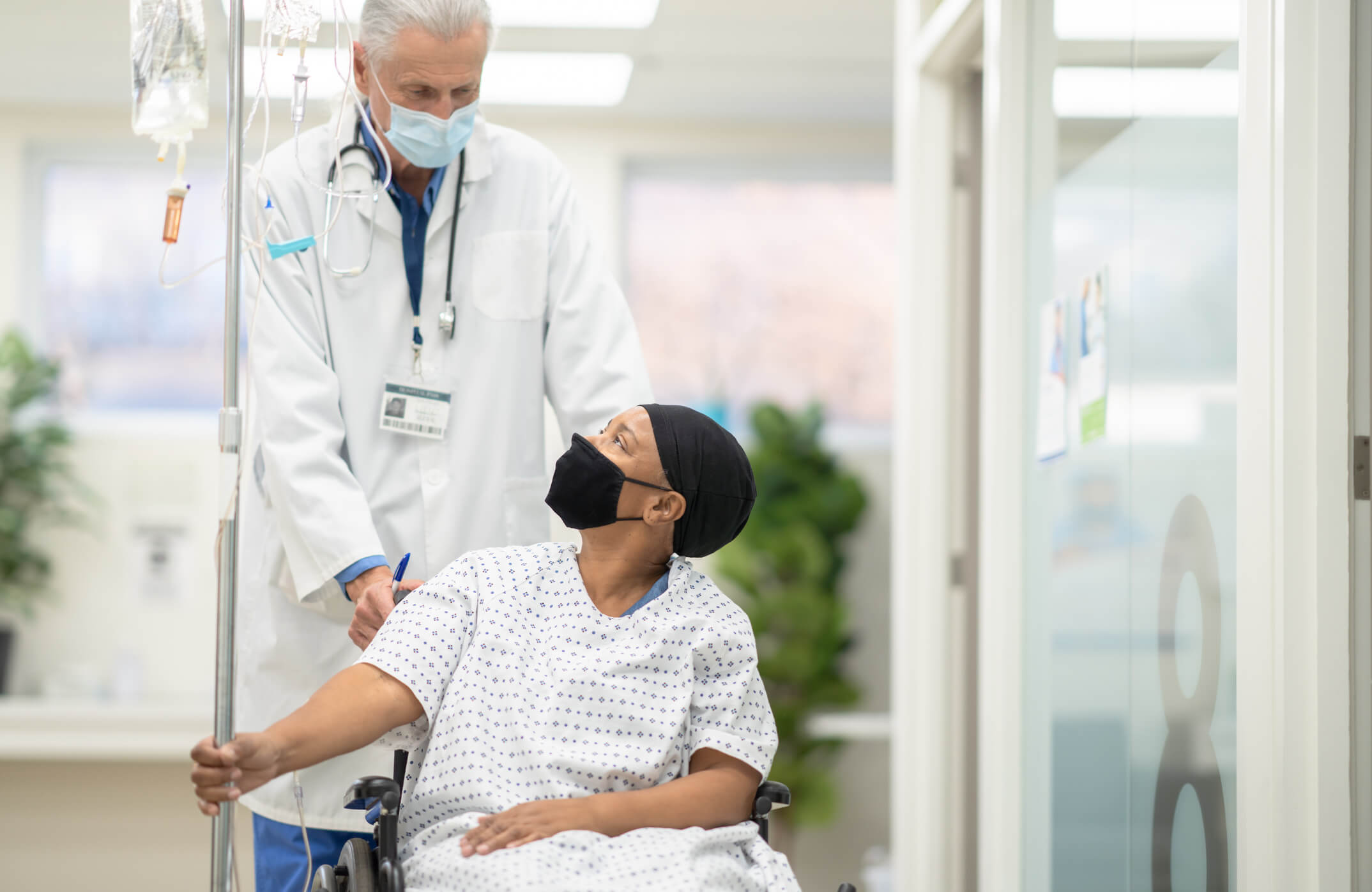 Doctor and patient wearing masks.