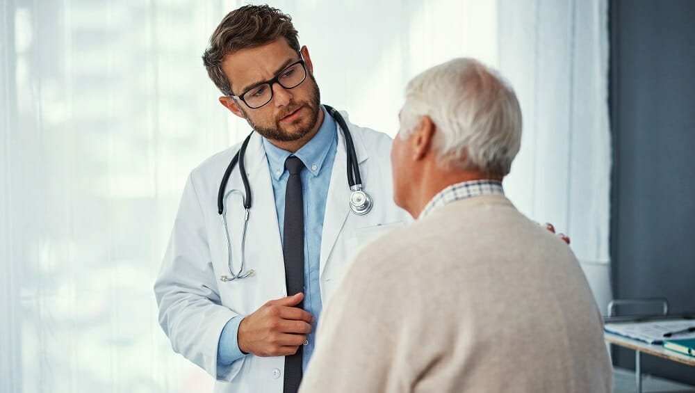 Doctor talking to older patient