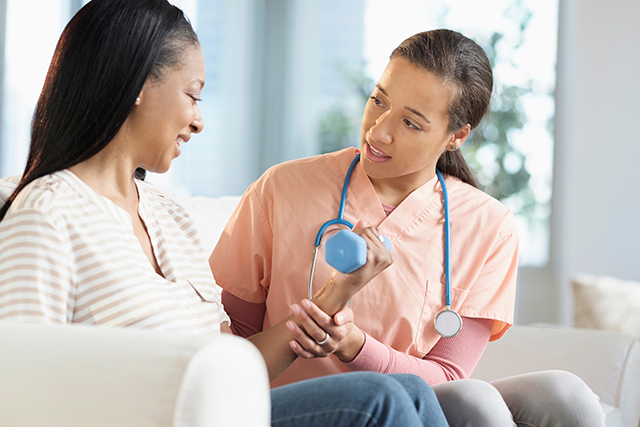 A nurse and patient discuss an exercise regimen.