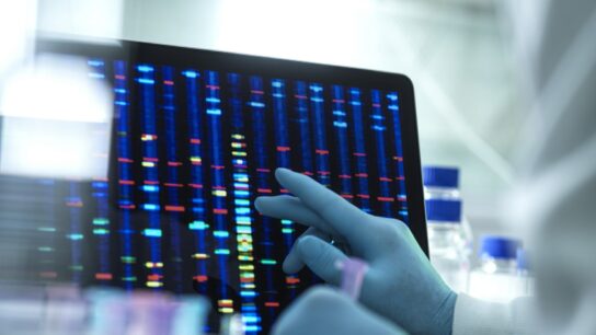 Scientist examining genetic testing results on a screen