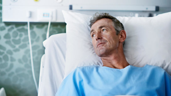 A patient with cancer waits for treatment.