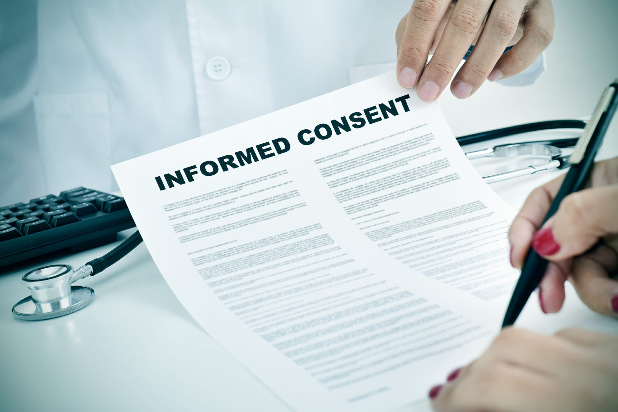 Patient signing informed consent form