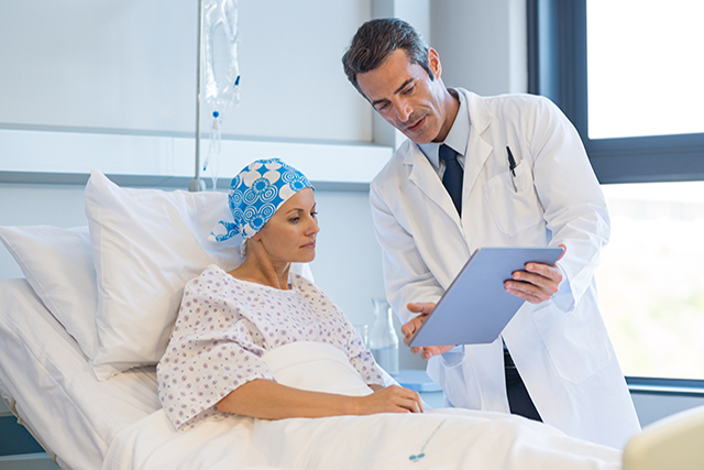 Reviewing test results with a patient with cancer.