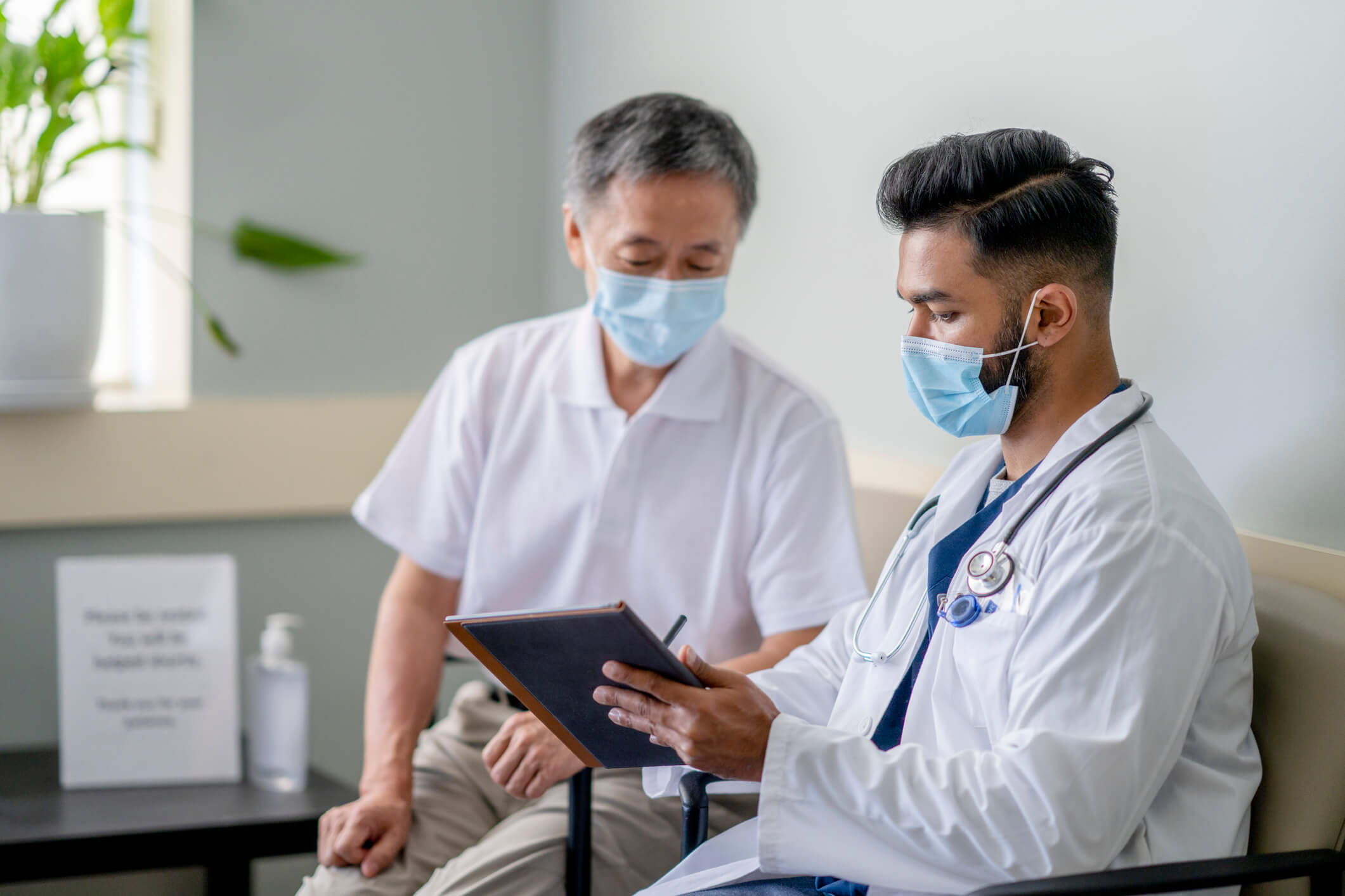 Male patient talking to doctor.