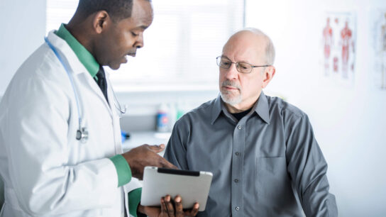 Doctor with older male patient