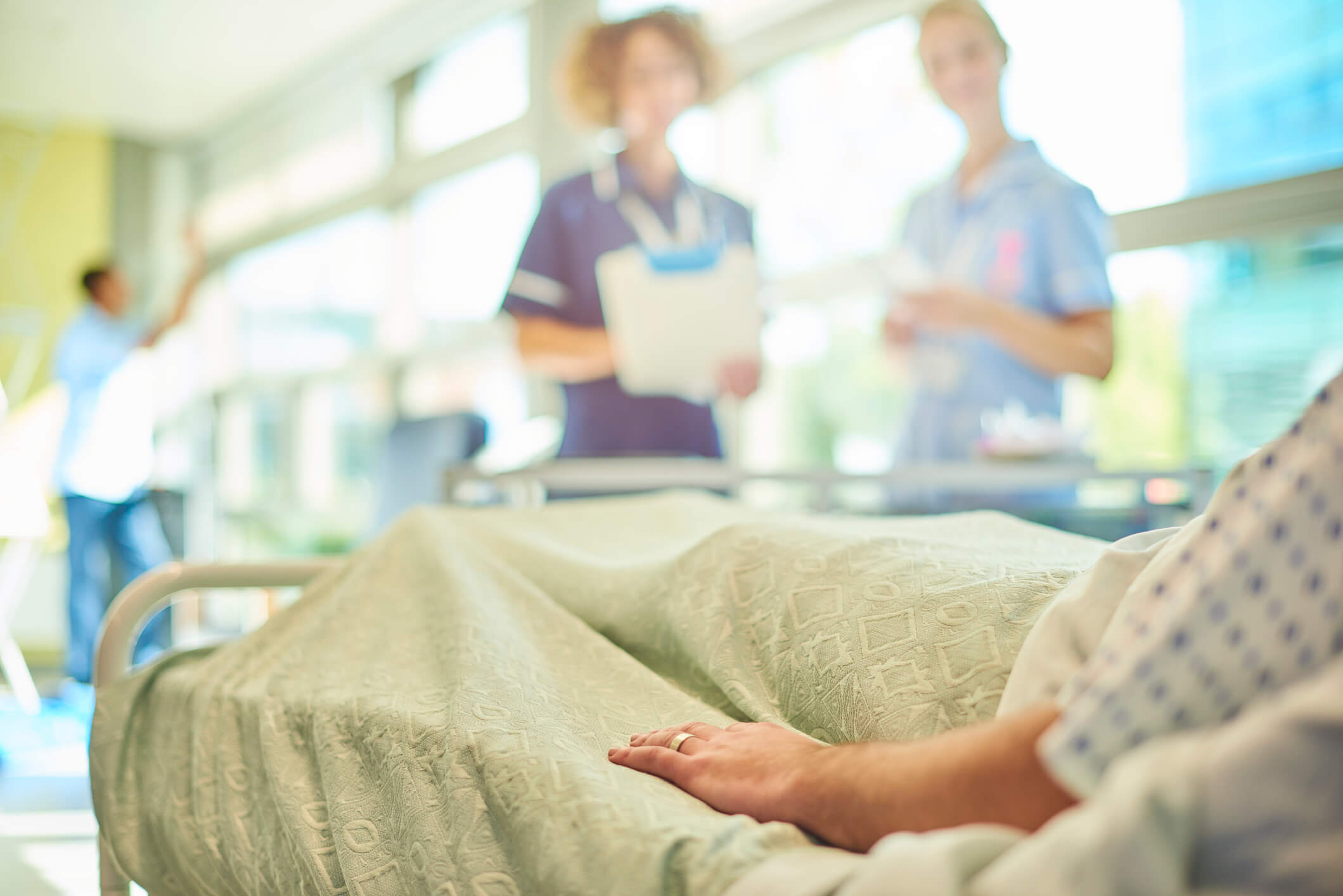 Patient in hospital bed.