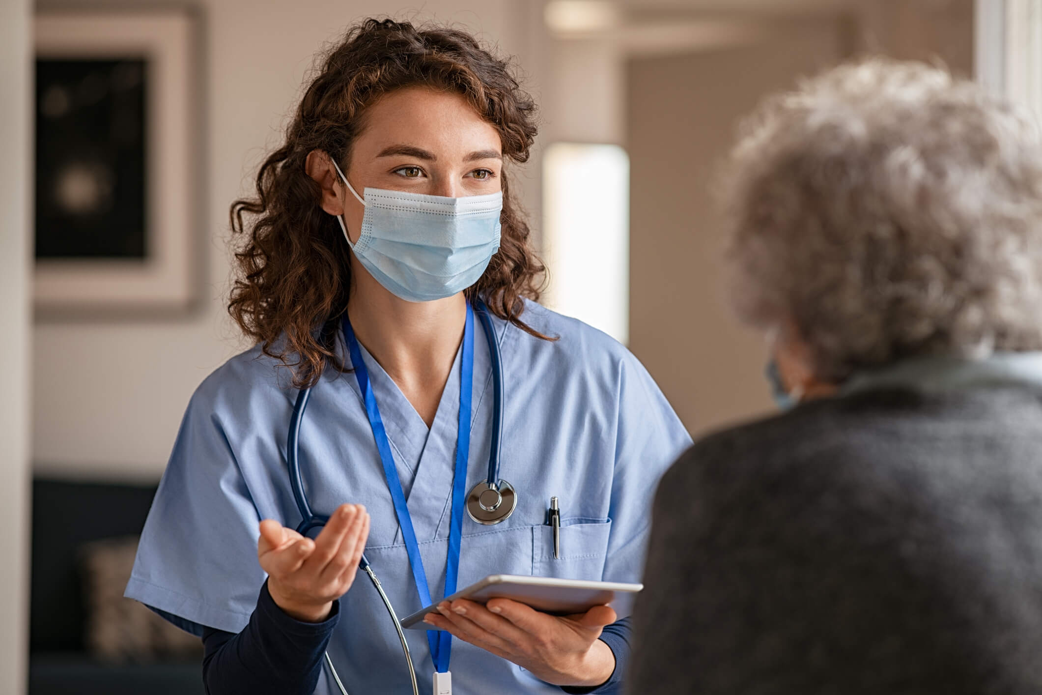 Nurse talking to patient.