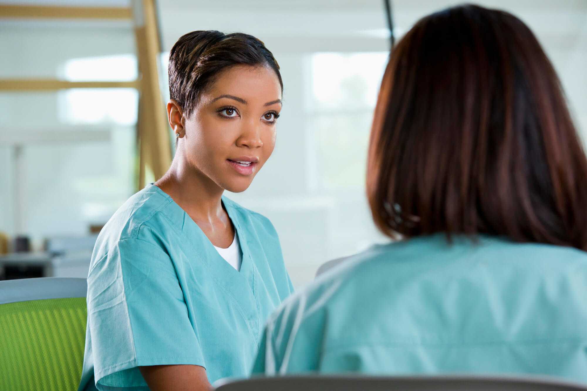 Nurses discussing cancer therapy.