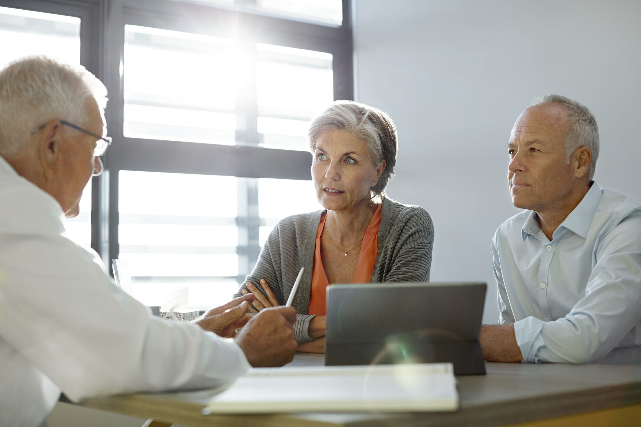 Doctor talking to couple