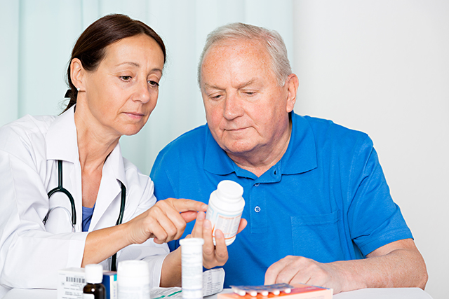 Discussing medication with a patient.