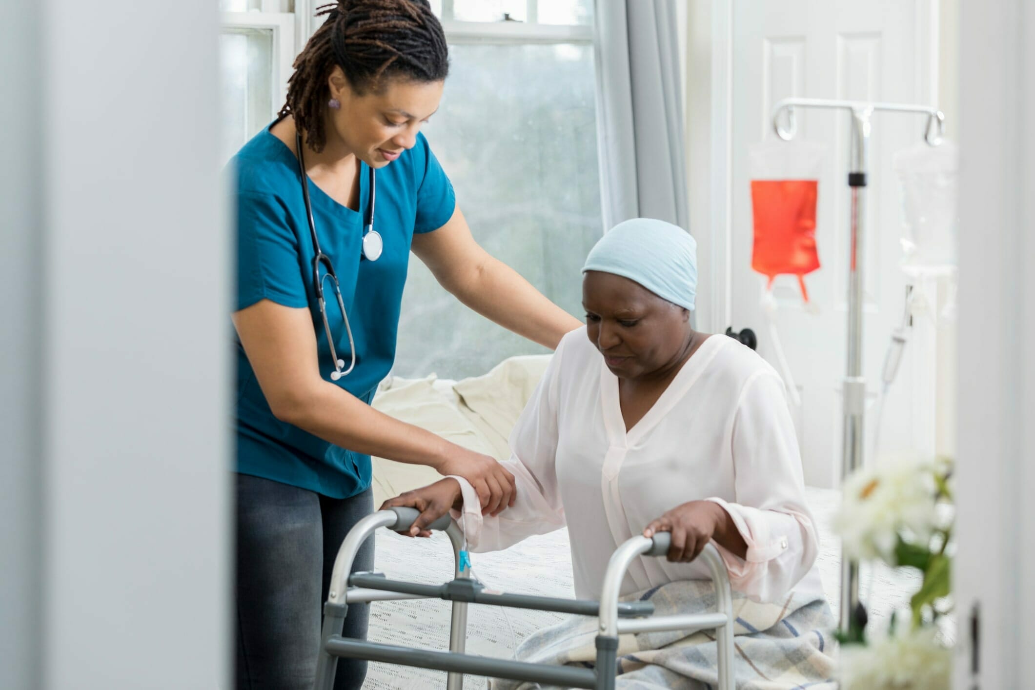 Health care worker helping cancer patient