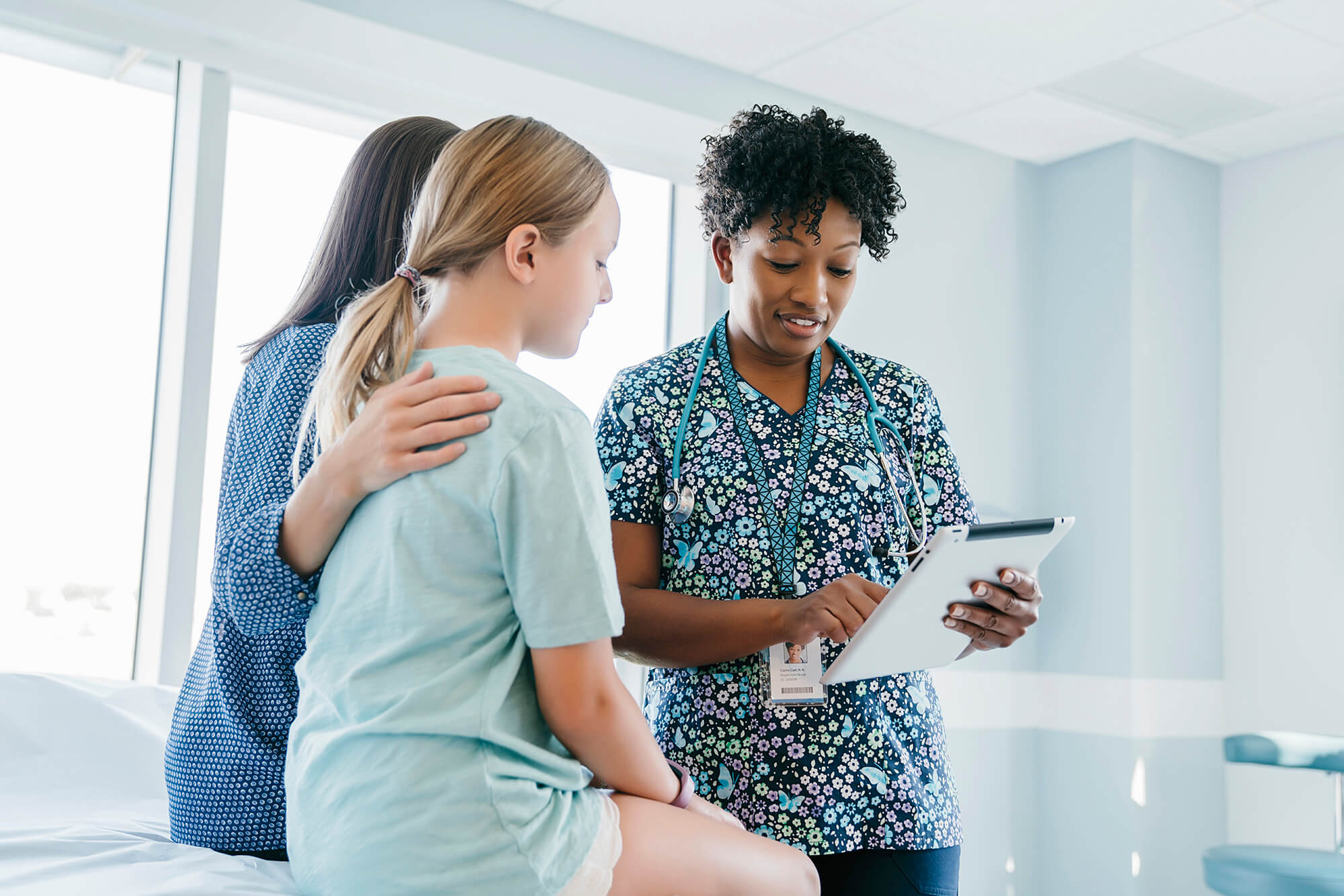 Reviewing the care plan for a young patient.