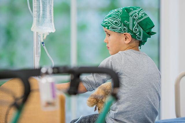 A young patient receives chemotherapy to treat his leukemia.