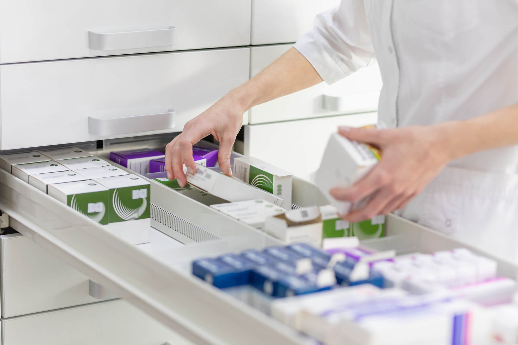 Pharmacist handling medications