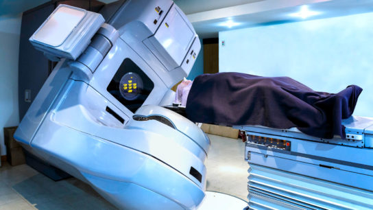 Patient receiving radiation therapy for cancer treatment in linear acelerator