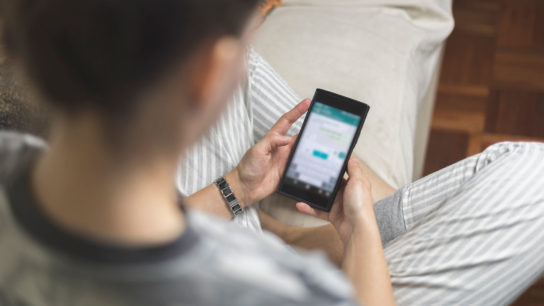 Patient using her smartphone.