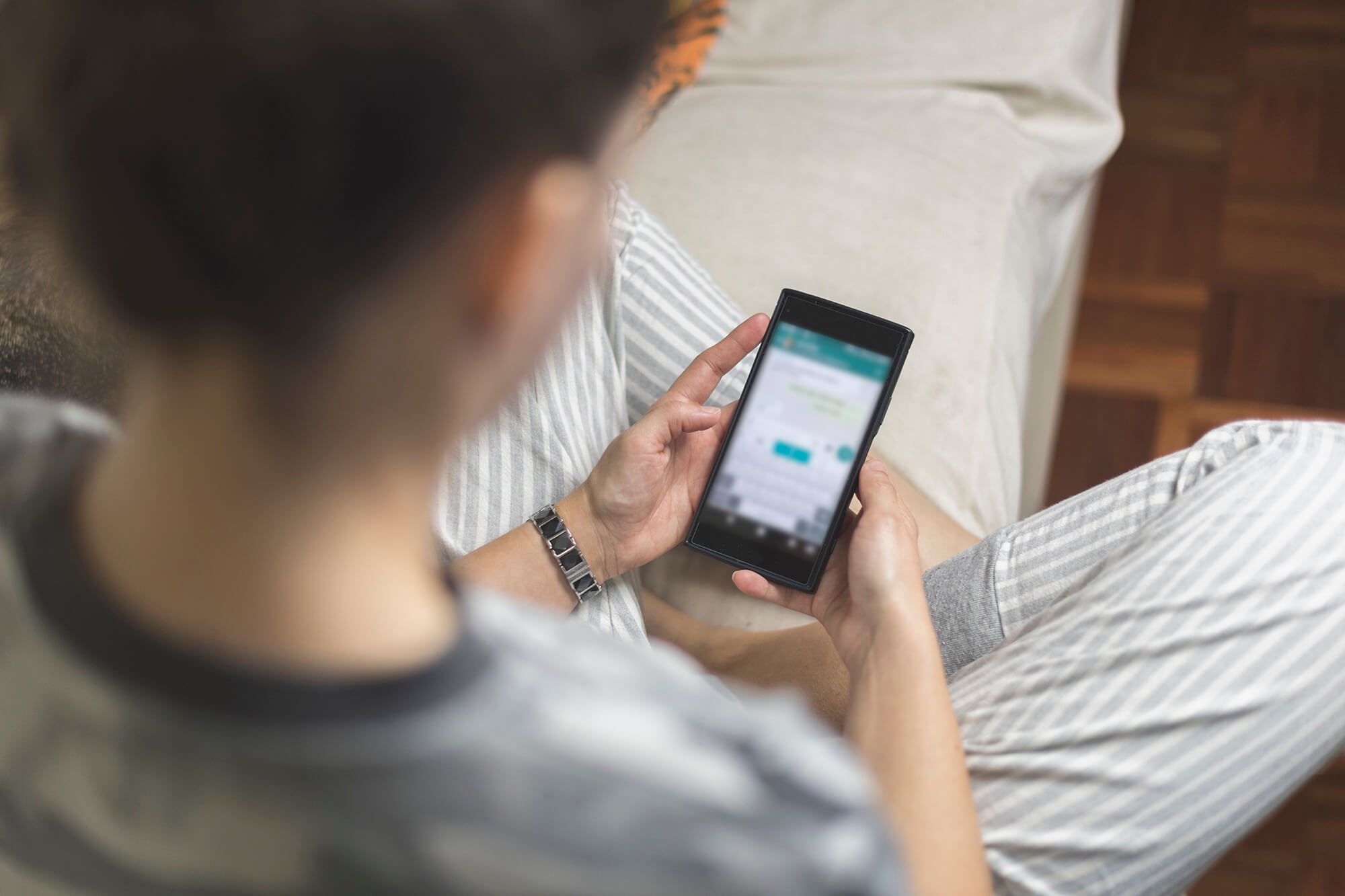 Patient using her smartphone.